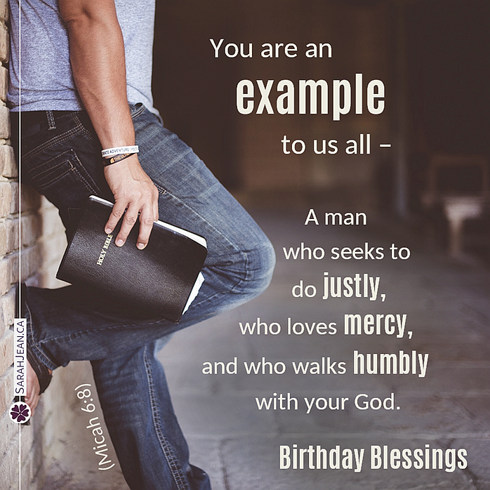 Man leaning against a brick wall holding a Bible on Birthday Free Christian eCard.